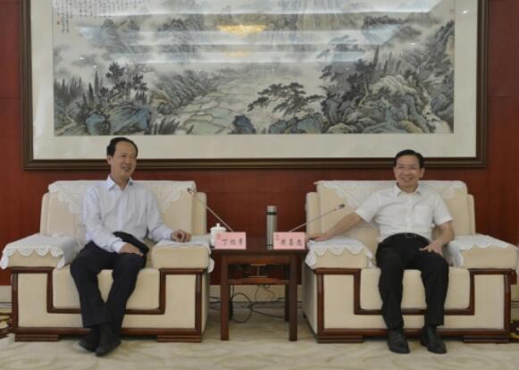 丁焰章拜會南昌市委副書記、市長黃喜忠